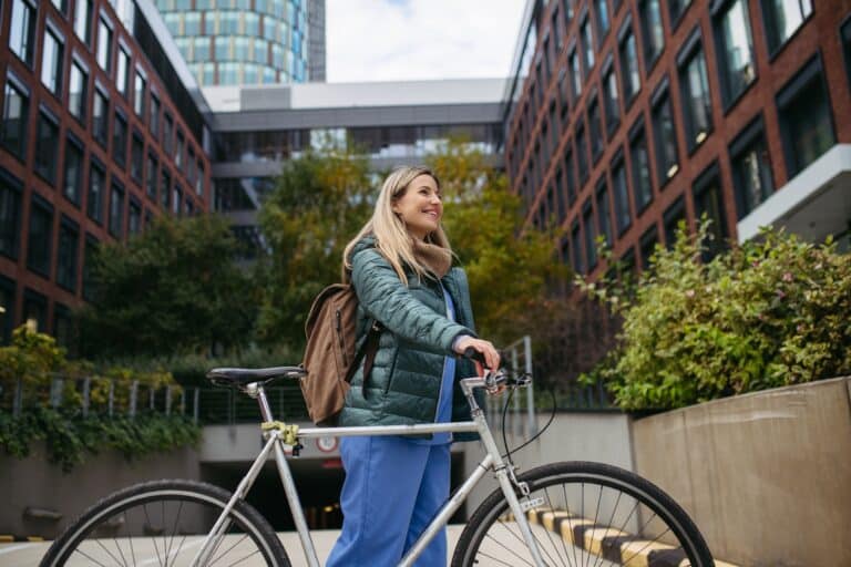 Young nurse outside of hospital with bike