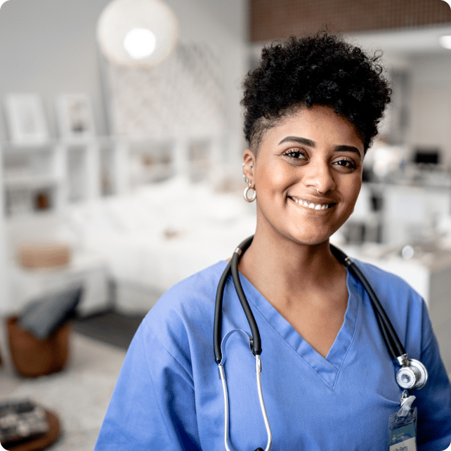 Young mixed race nurse in blue scrubs wearing a stethoscope