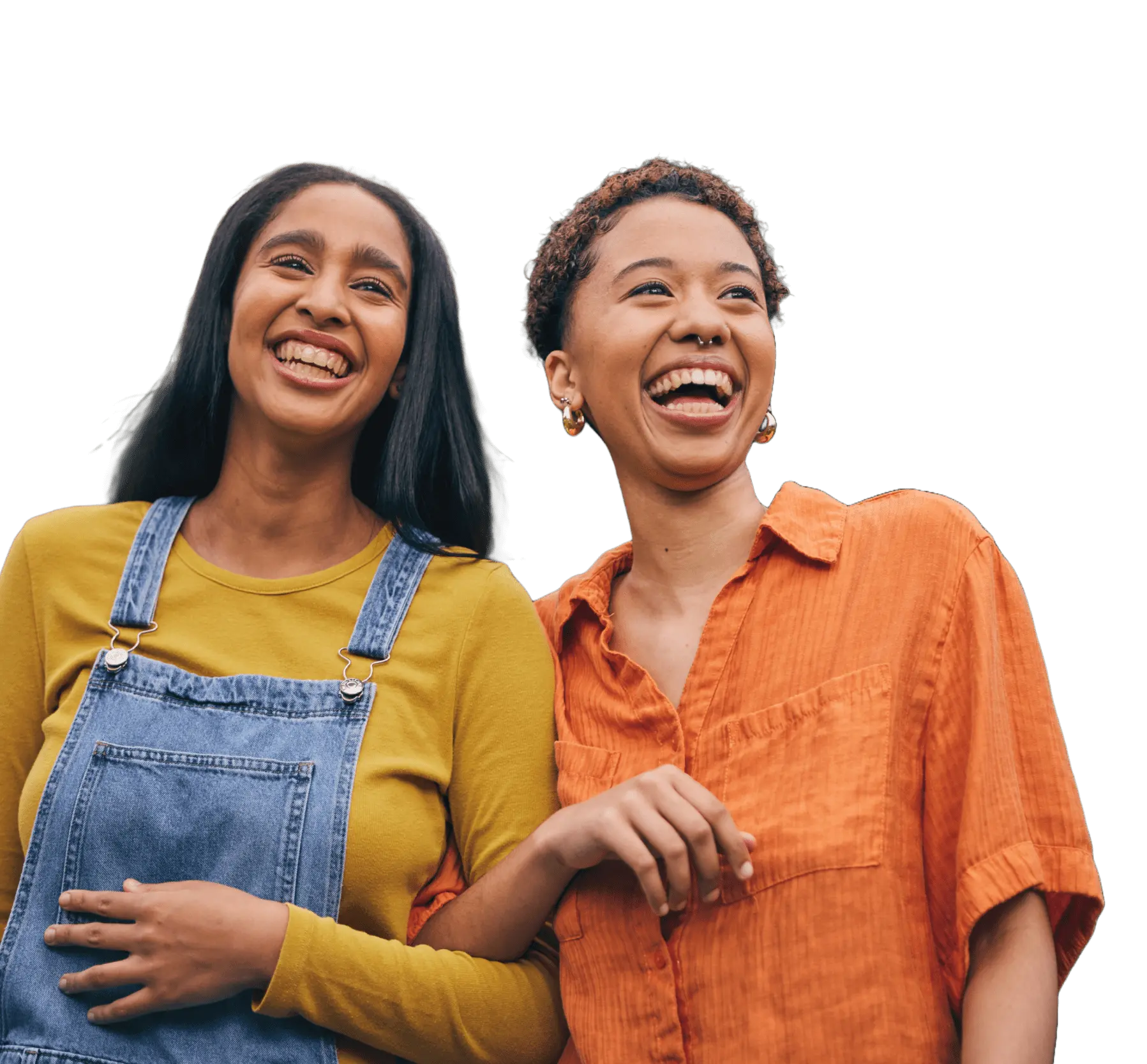 Cutout of two young friends walking arm-in-arm laughing against a transparent background