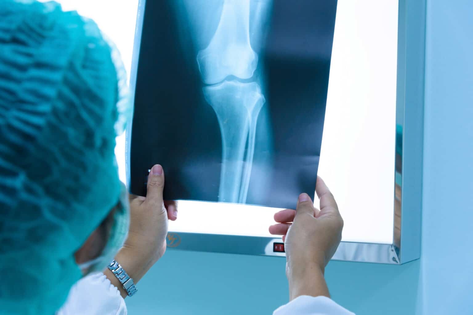 Home - Allied Careers Imaging specialist reviewing X-ray image of leg