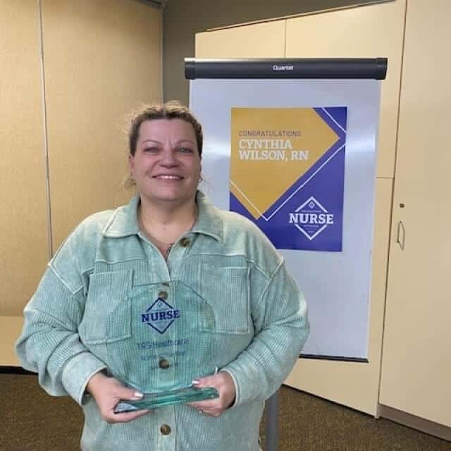 Cynthia Wilson with her TRS Healthcare Nurse of the Year 2023 award at a celebration in Kansas