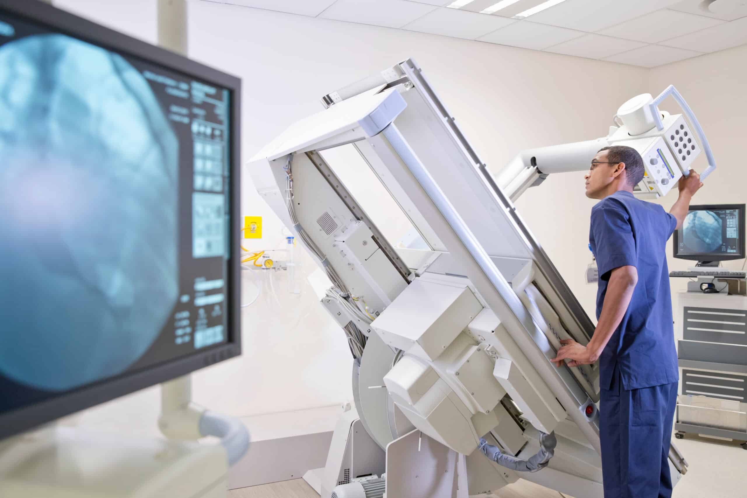 Male radiographer working in hospital X-ray department
