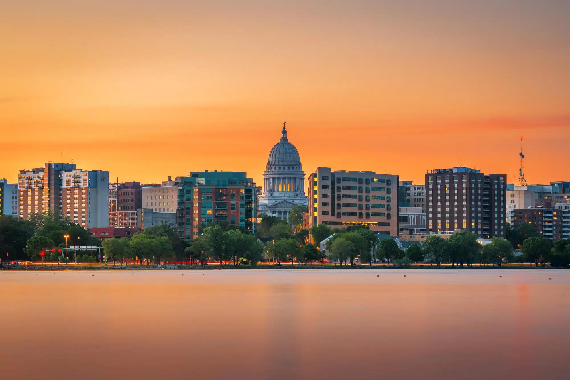 Madison, Wisconsin downtown skyline at dusk on Lake Monona