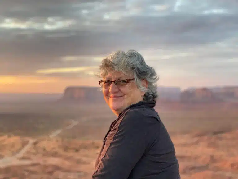 Susan Cavanagh, RN, with New Mexico landscape in background