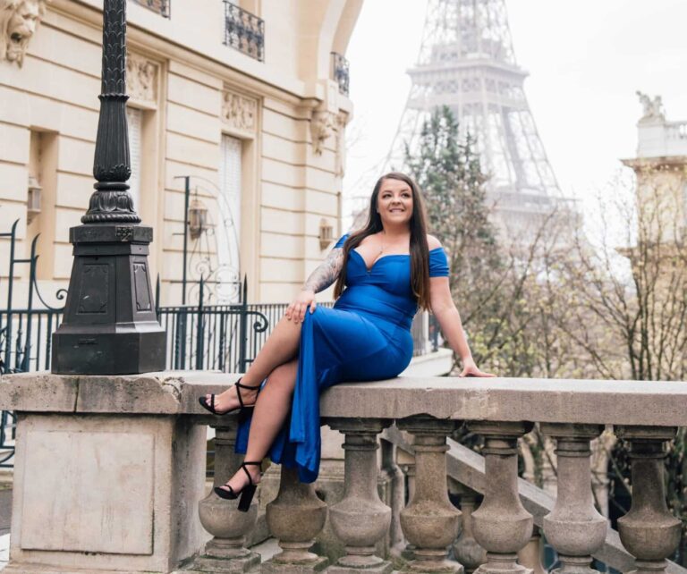 Ashlie Yoder, RN, takes picture in front of Eiffel Tower in Paris, France