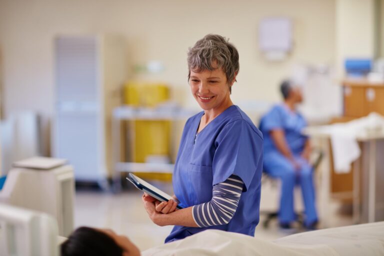 Shot of a nurse standing by her patients bedside