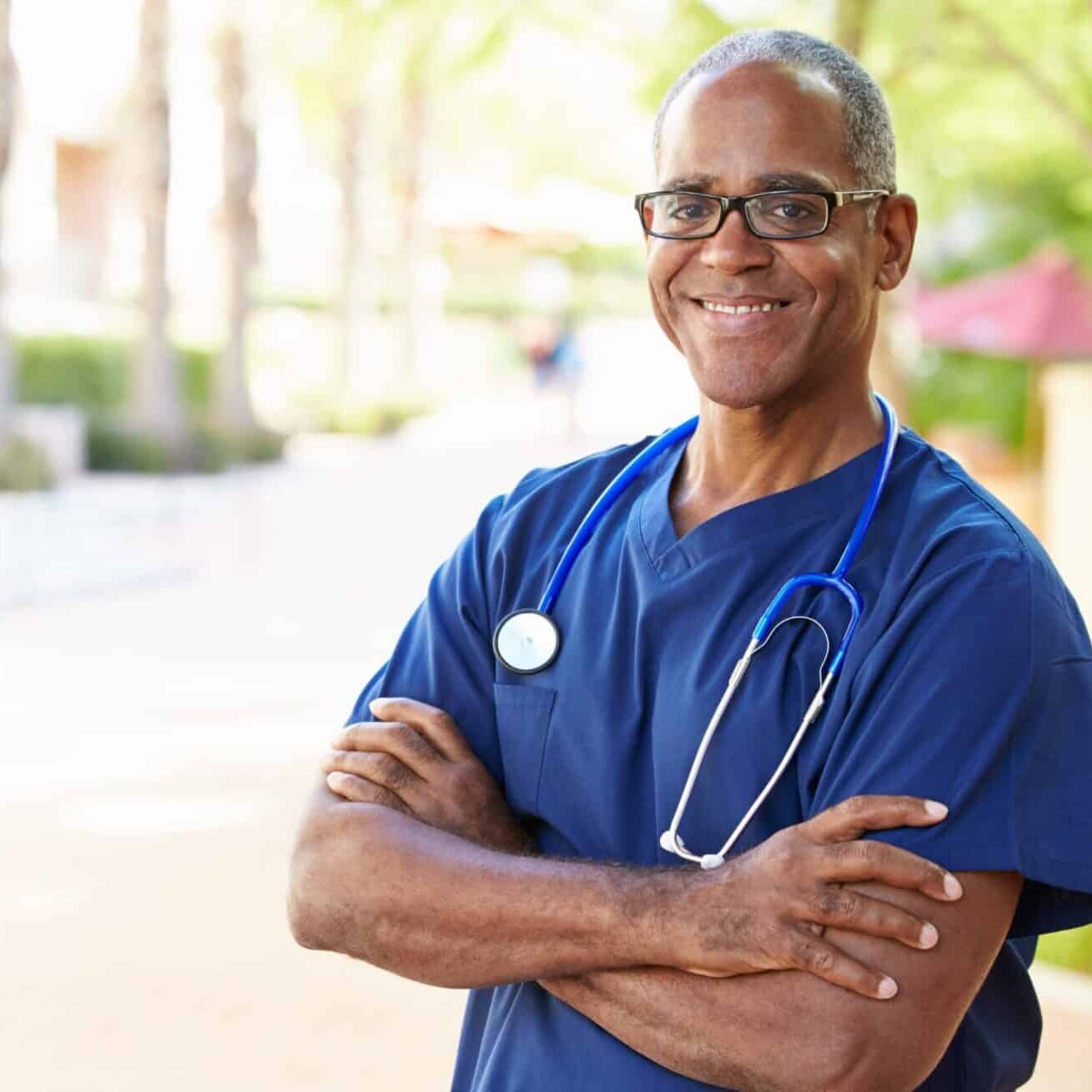 Travel Nursing Support with TRS Healthcare Middle-aged Black male nurse with stethoscope
